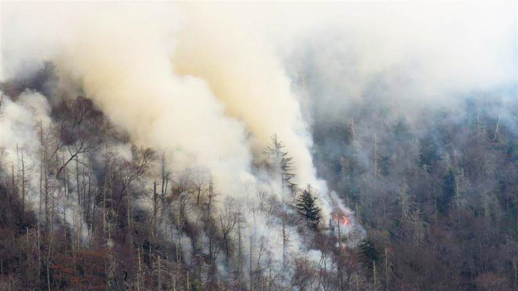 Raging wildfires in and around the resort towns of Gatlinburg, Pigeon Forge and Sevierville spurred thousands of evacuations.