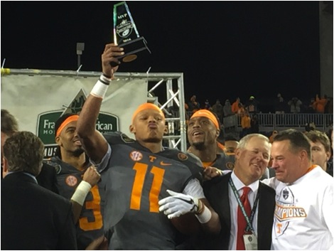MVP Joshua Dobbs with Bowl officials and Coach Butch Jones